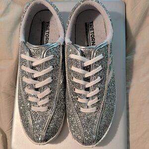 Tretorn silver glitter shoes.